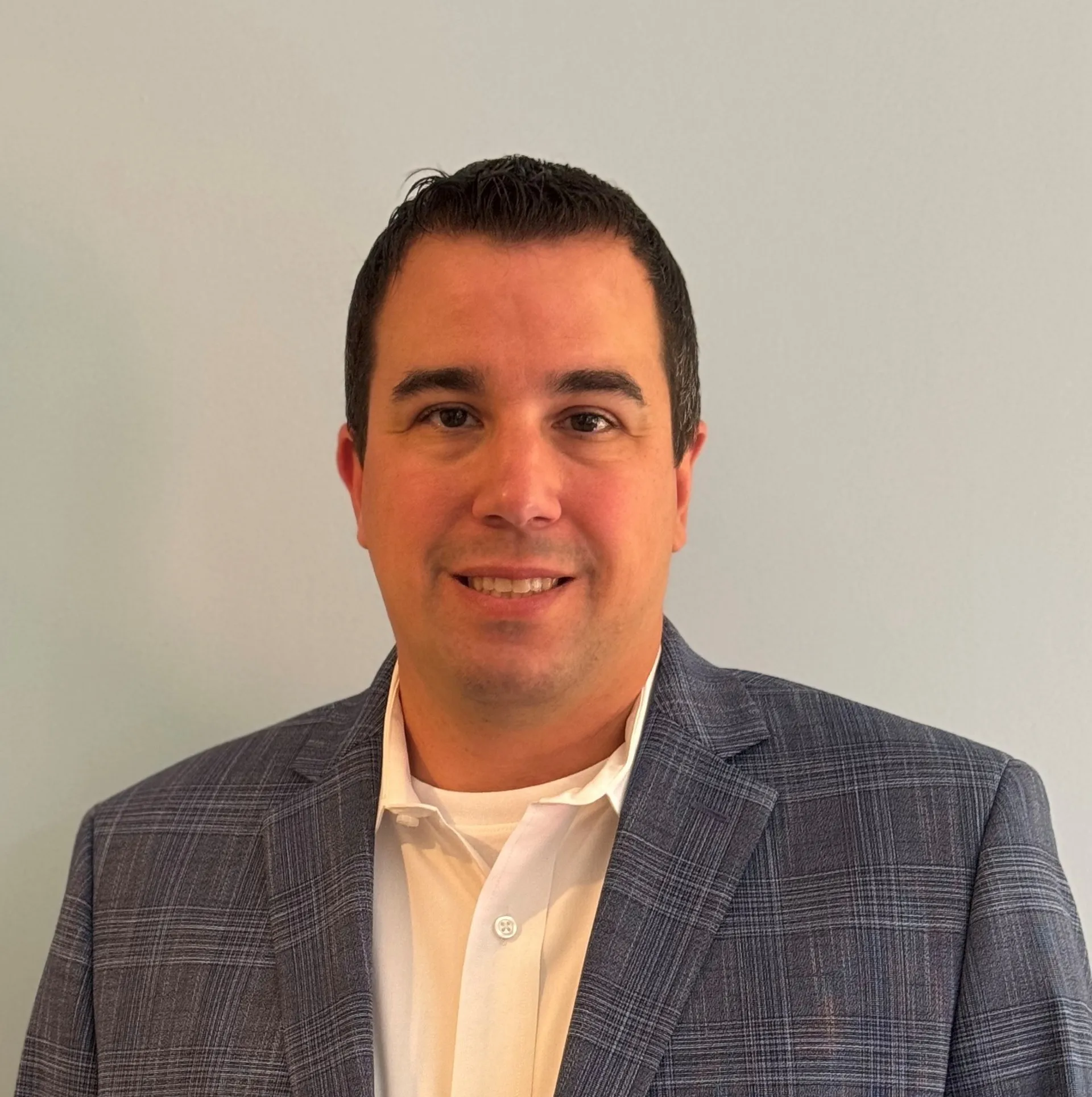 Headshot portrait of Jon L, a Systems With Intelligence team member